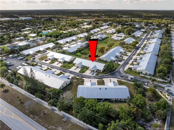 an aerial view of residential houses with outdoor space