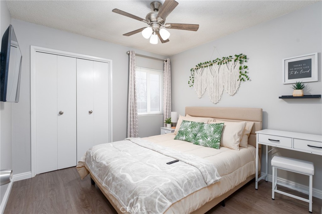 716 Orange Street Riverside, CA 92501 - Photo 18 of 28 a bedroom with a bed and a chandelier
