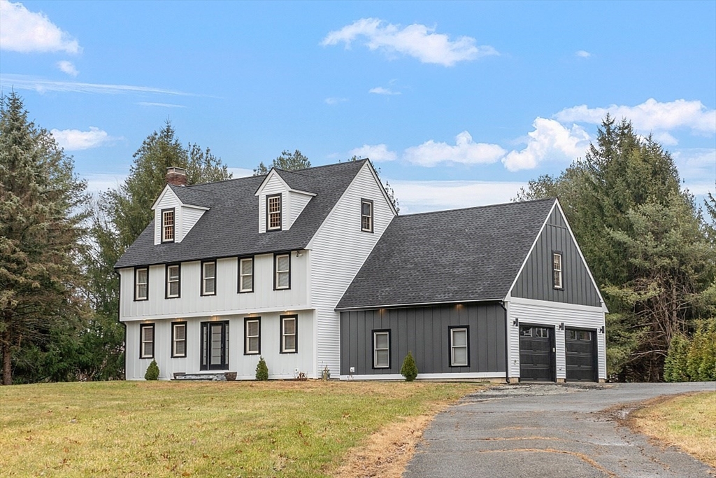22 Coleman Road Groveland, MA 01834 - Photo 1 of 35 a front view of a house with a garden