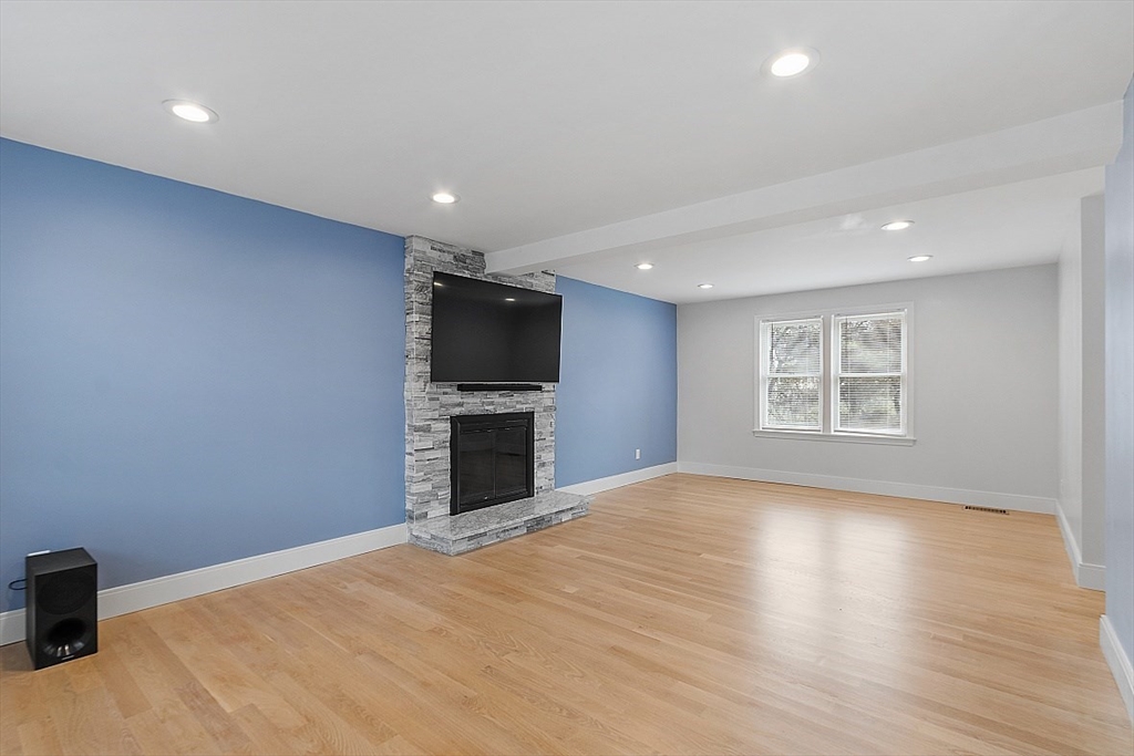 22 Coleman Road Groveland, MA 01834 - Photo 12 of 35 a view of empty room with wooden floor and tv