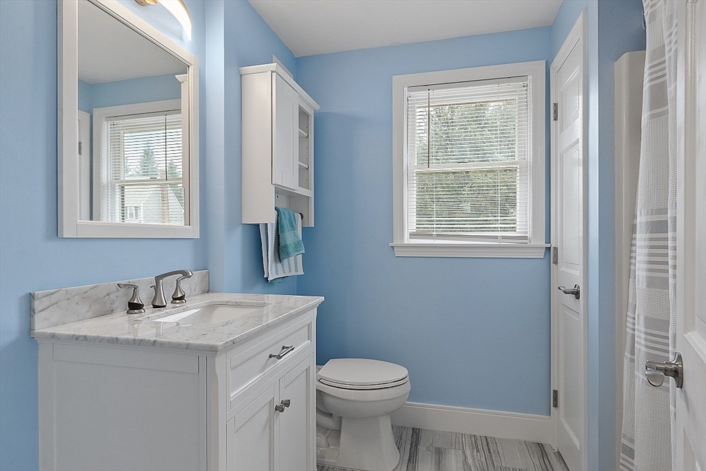 22 Coleman Road Groveland, MA 01834 - Photo 13 of 35 a bathroom with a sink toilet and a mirror