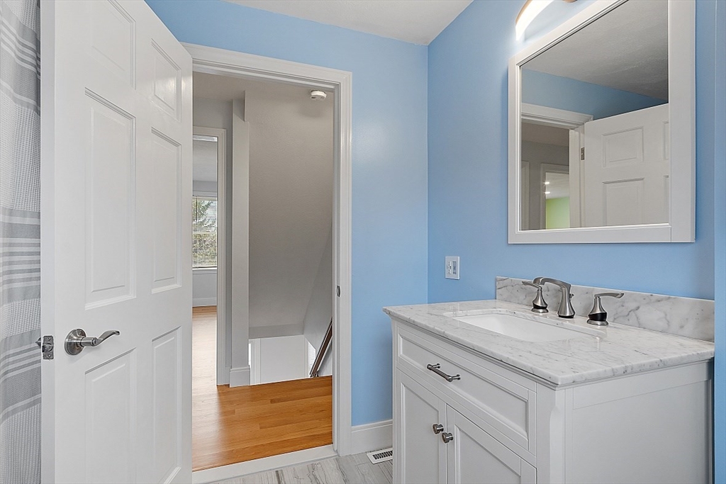 22 Coleman Road Groveland, MA 01834 - Photo 14 of 35 a bathroom with a sink and a mirror