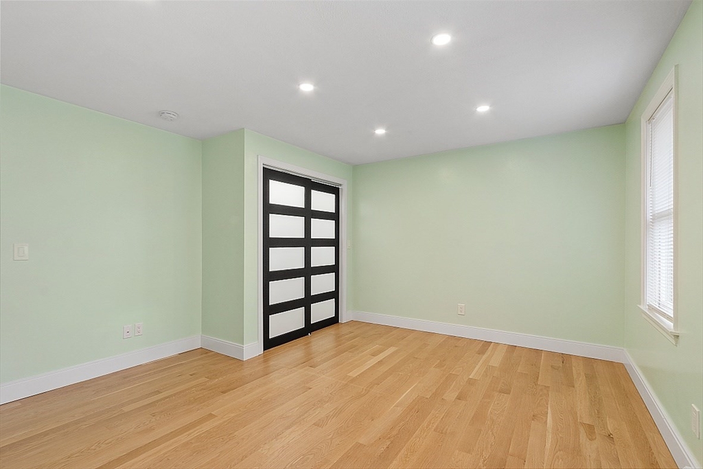 22 Coleman Road Groveland, MA 01834 - Photo 15 of 35 a view of empty room with wooden floor and fan