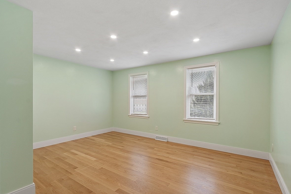 22 Coleman Road Groveland, MA 01834 - Photo 16 of 35 a view of empty room with wooden floor and fan