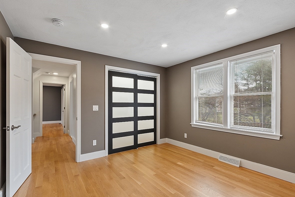 22 Coleman Road Groveland, MA 01834 - Photo 17 of 35 wooden floor in an empty room with a window