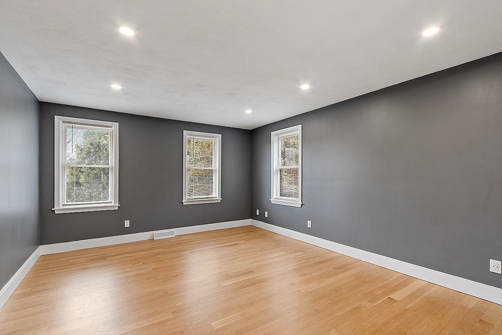 22 Coleman Road Groveland, MA 01834 - Photo 19 of 35 a view of empty room with wooden floor and fan