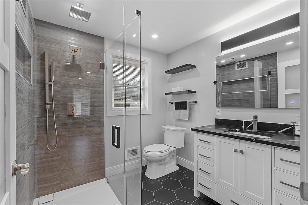 22 Coleman Road Groveland, MA 01834 - Photo 21 of 35 a bathroom with a double vanity sink toilet and shower