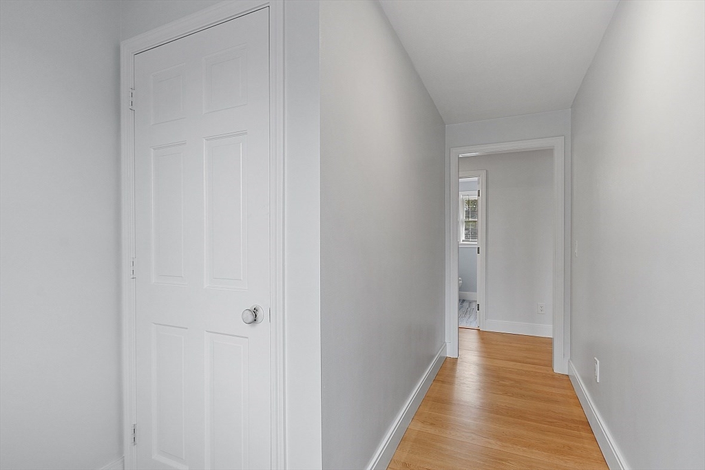 22 Coleman Road Groveland, MA 01834 - Photo 25 of 35 a view of a hallway with wooden floor