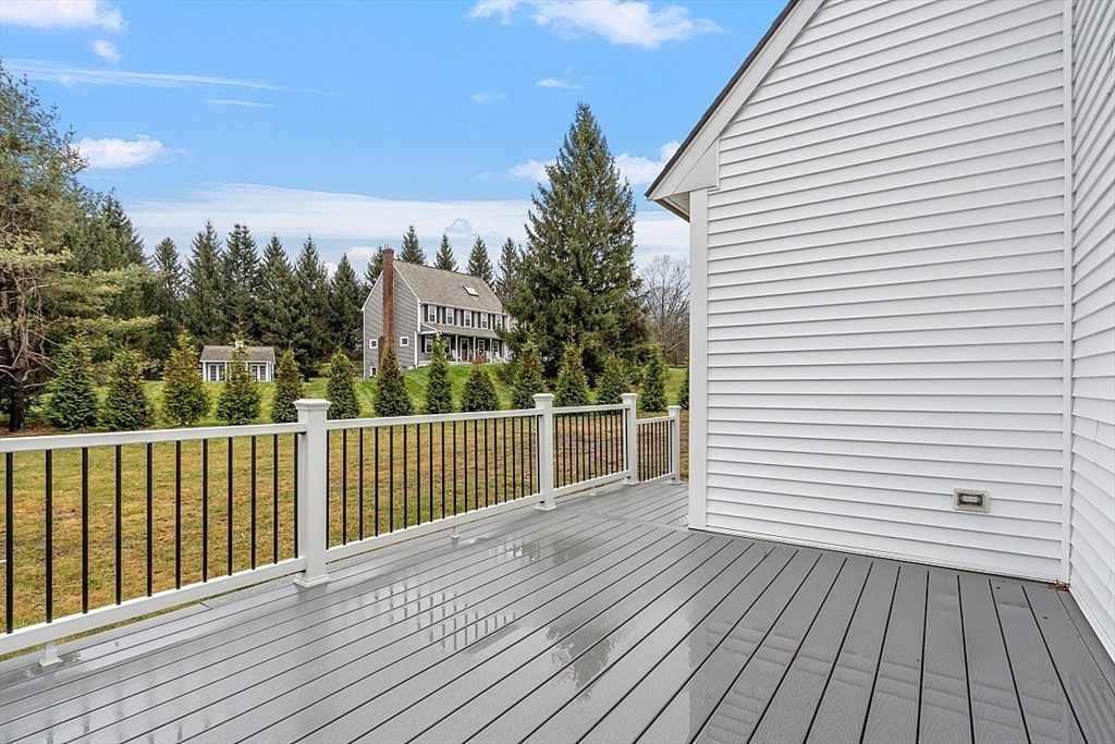 22 Coleman Road Groveland, MA 01834 - Photo 32 of 35 a view of a roof with wooden floor and fence