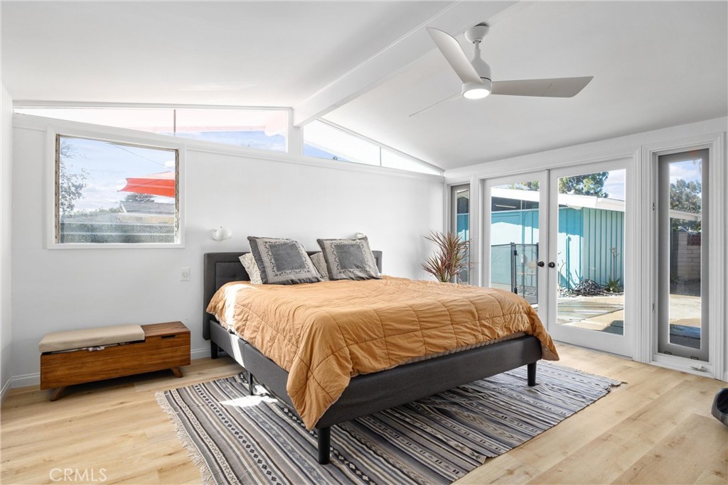 13062 Chaplet Place Tustin, CA 92780 - Photo 13 of 27 a bedroom with a bed and glass walk in closet