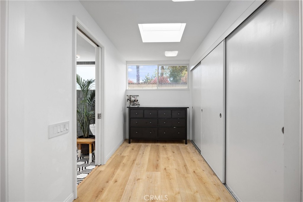 13062 Chaplet Place Tustin, CA 92780 - Photo 14 of 27 a view of a hallway with wooden floor and staircase