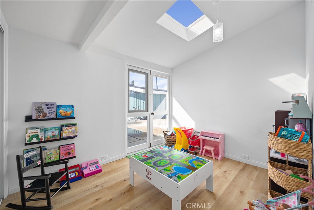 13062 Chaplet Place Tustin, CA 92780 - Photo 18 of 27 a living room with furniture and a wooden floor