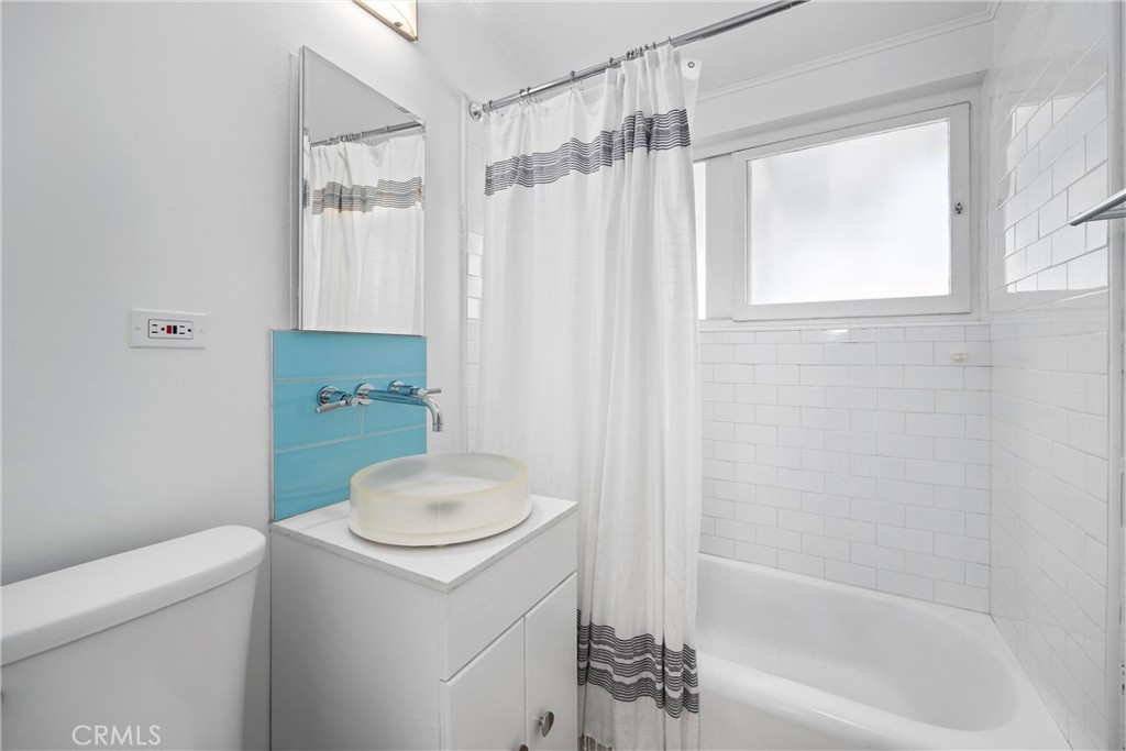13062 Chaplet Place Tustin, CA 92780 - Photo 19 of 27 a bathroom with a sink a toilet and a bathtub