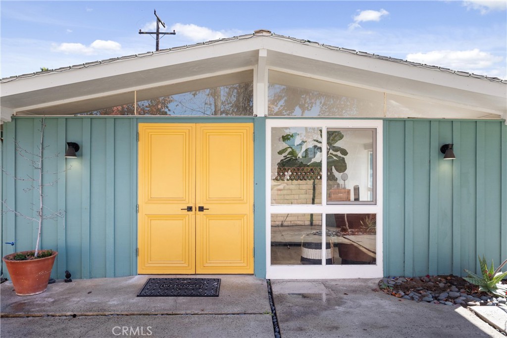 13062 Chaplet Place Tustin, CA 92780 - Photo 2 of 27 a view of a hallway with wooden door