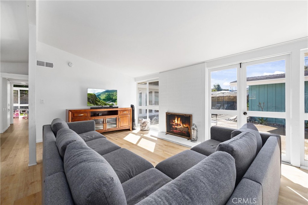 13062 Chaplet Place Tustin, CA 92780 - Photo 10 of 27 a living room with furniture and a fireplace