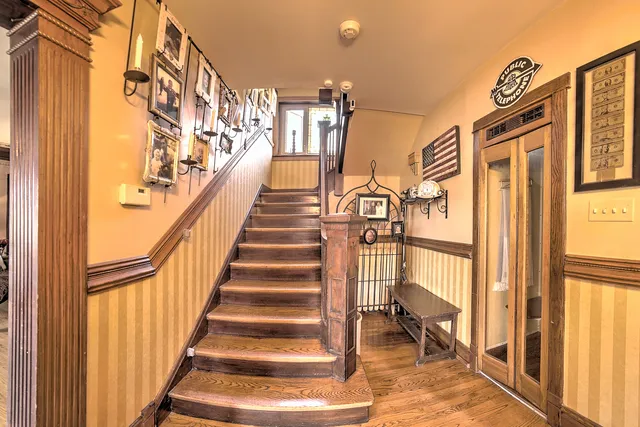 a dining room with furniture and wooden floor