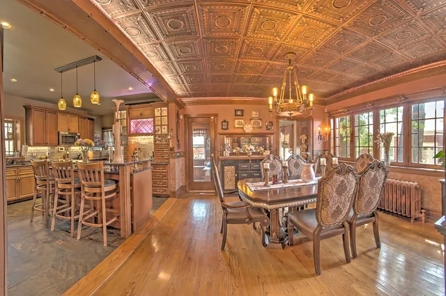 a dining room with furniture and wooden floor