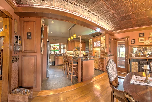 a kitchen with stainless steel appliances kitchen island granite countertop a stove and cabinets
