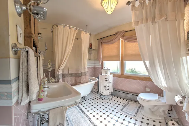 a bathroom with a bathtub and a shower