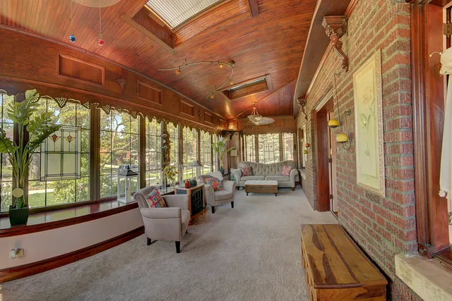 a view of an entryway with wooden floor and door