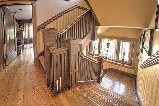 a bed room with a bed and a chandelier