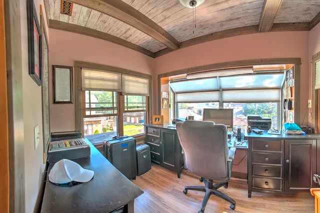 a bathroom with a sink mirror vanity and toilet