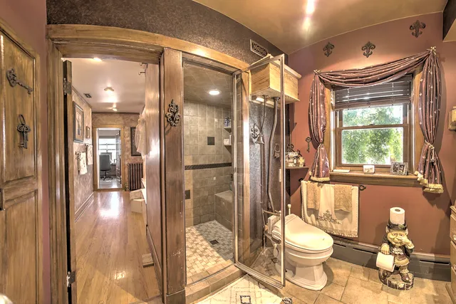 a bathroom with a tub and shower