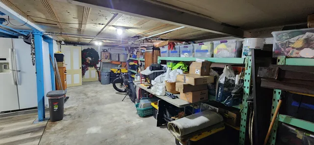 a view of a patio with couches table and chairs and potted plants