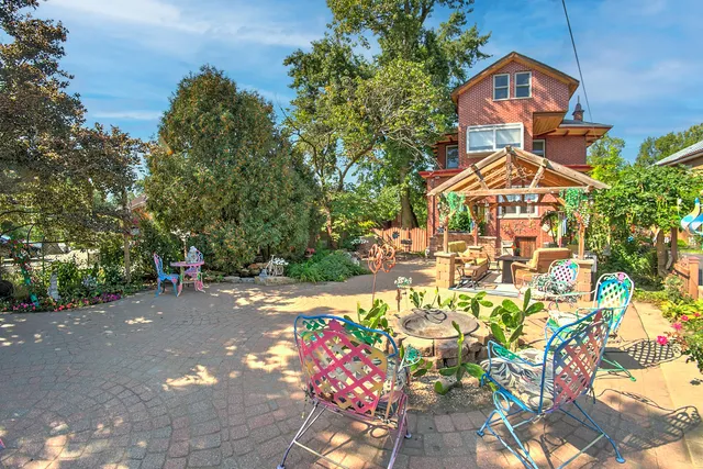 a view of a chairs and table on the balcony