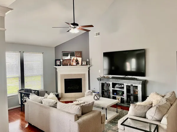 a living room with furniture and a flat screen tv