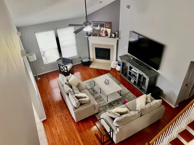 a living room with furniture and a flat screen tv
