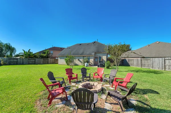 a view of backyard with seating space and garden