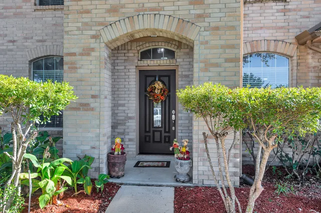 a front view of a house with outdoor seating