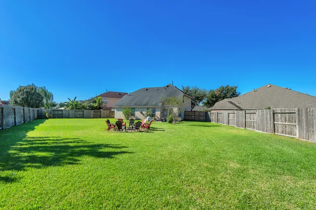 a view of a house with a yard porch and sitting area