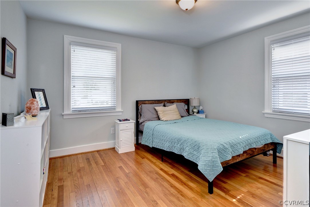 905 Lake Road Richmond, VA 23220 - Photo 16 of 50 a bedroom with a bed and wooden floor