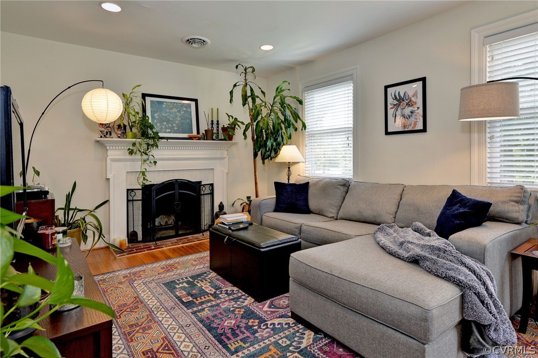 905 Lake Road Richmond, VA 23220 - Photo 28 of 50 a living room with furniture a fireplace and a potted plant