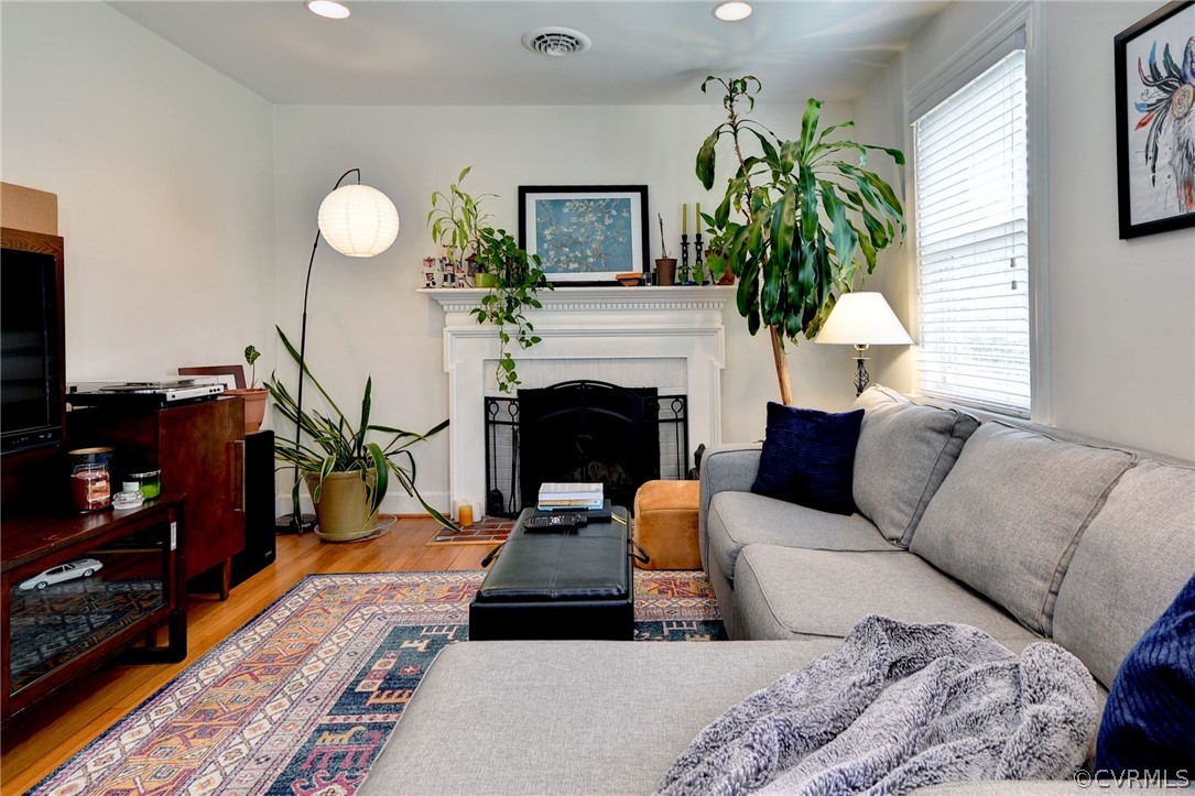 905 Lake Road Richmond, VA 23220 - Photo 29 of 50 a living room with furniture a fireplace and next to windows