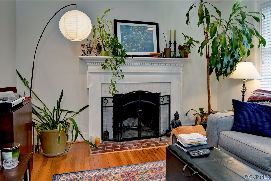 905 Lake Road Richmond, VA 23220 - Photo 30 of 50 a living room with furniture a fireplace and a potted plant
