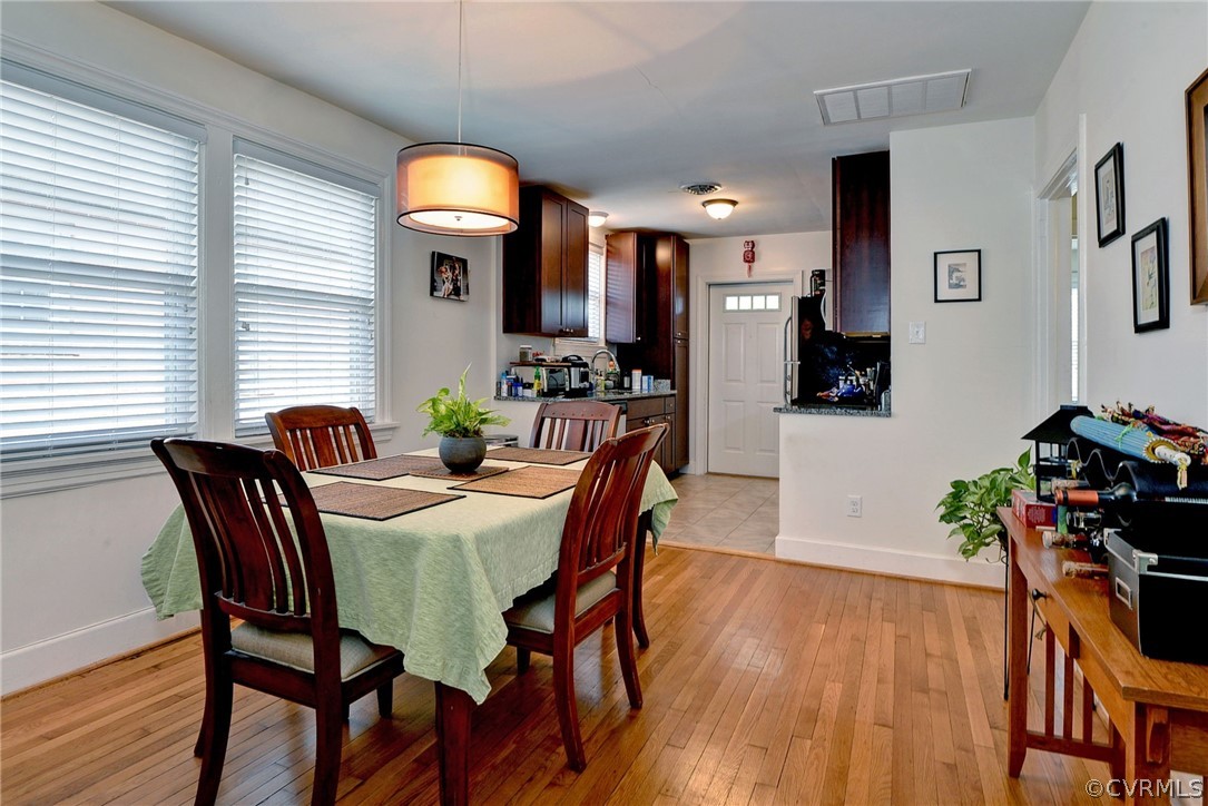 905 Lake Road Richmond, VA 23220 - Photo 32 of 50 a view of a dining room with furniture and wooden floor