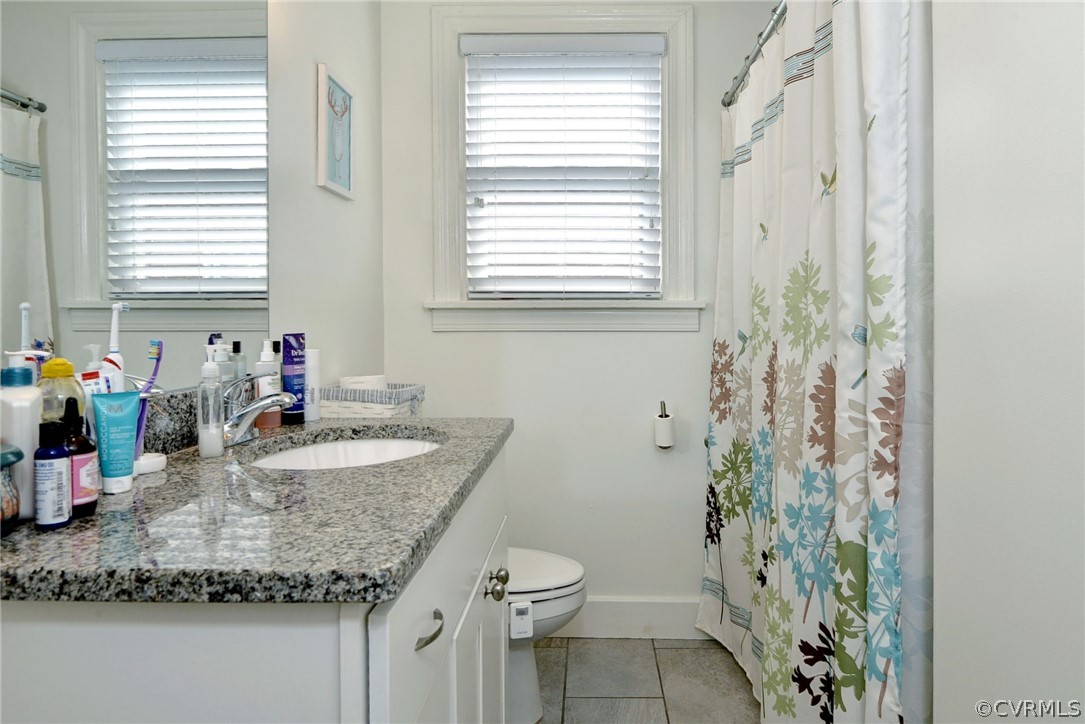 905 Lake Road Richmond, VA 23220 - Photo 39 of 50 a bathroom with a granite countertop sink and a mirror