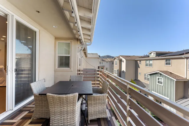 a view of a balcony with furniture