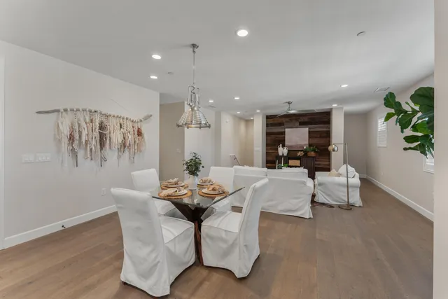 a kitchen with a stove a counter space a sink and cabinets