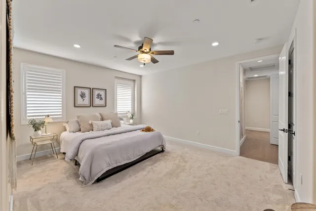 a bathroom with a double vanity sink mirror and shower