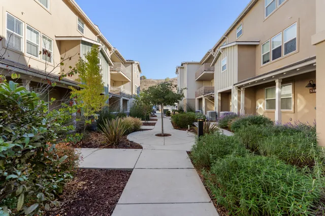 a view of a building with a yard