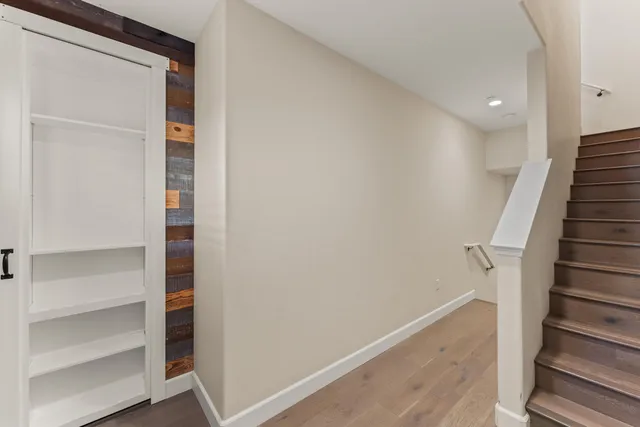 a view of entryway with stairs and wooden floor