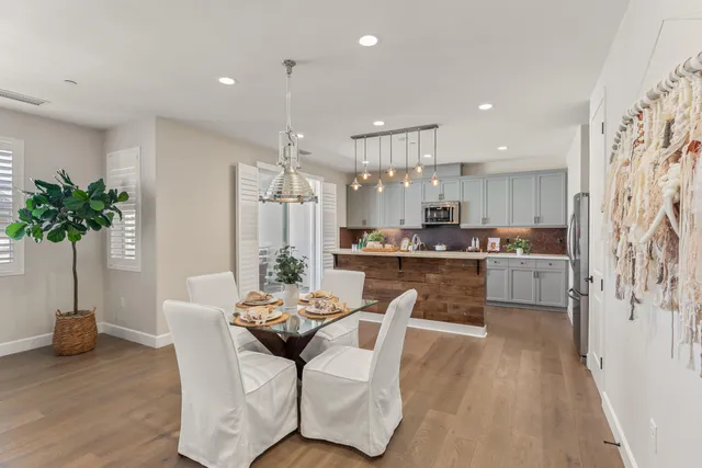 a kitchen with a table and chairs