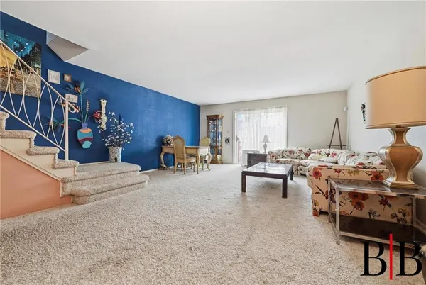 a living room with furniture and a table