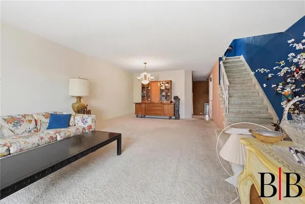 a living room with furniture and a couch