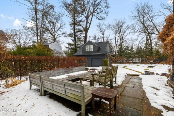 a view of a patio with iron fence