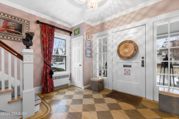 a view of a hallway with washer and dryer